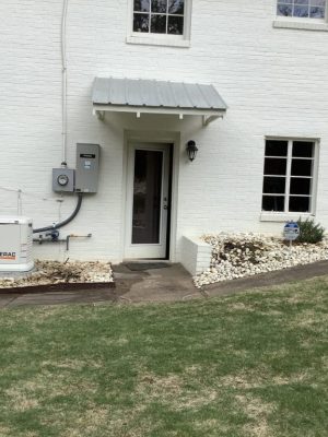 a house that is parked on the side of a building