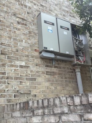 a person standing in front of a brick building