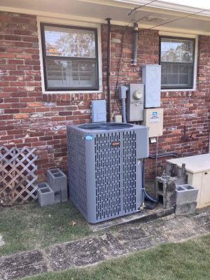 a chair sitting in front of a brick building