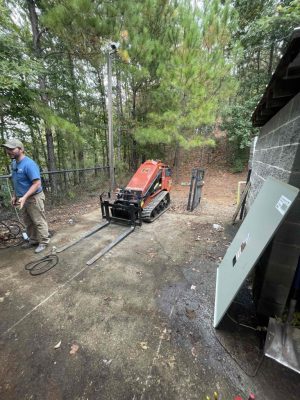 a man riding a bike down a dirt road